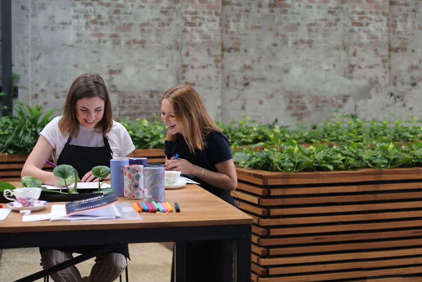Teacher leading a creative painting workshop with students